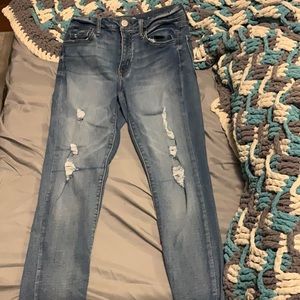 Light skinny jeans, slightly ripped